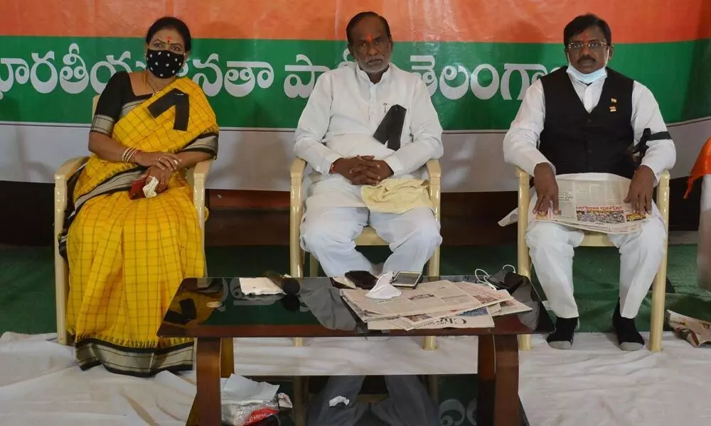 BJP national president of OBC Morcha Dr K Laxman, party national vice-president DK Aruna, former MP and senior BJP leader Vivek Venkataswamy on a daylong fast at the State party headquarters in Hyderabad on Tuesday