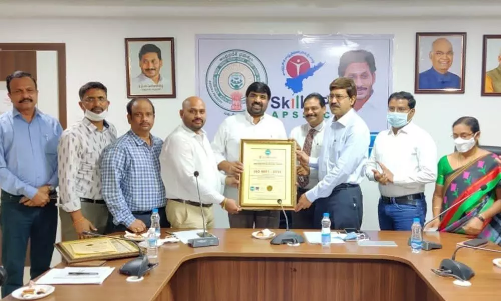 APSSDC Chairman Challa Madhusudan Reddy receiving the certificate from officials of UK-based Accreditation Services for Certifying Bodies