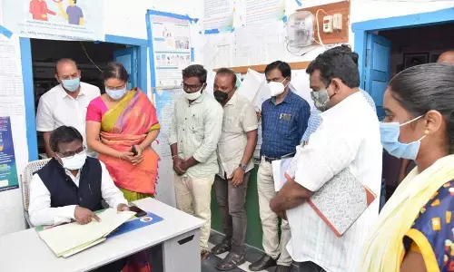 District Collector I Samuel Anand Kumar reviewing performance of village secretariat staff at Vankayalapadu on Wednesday