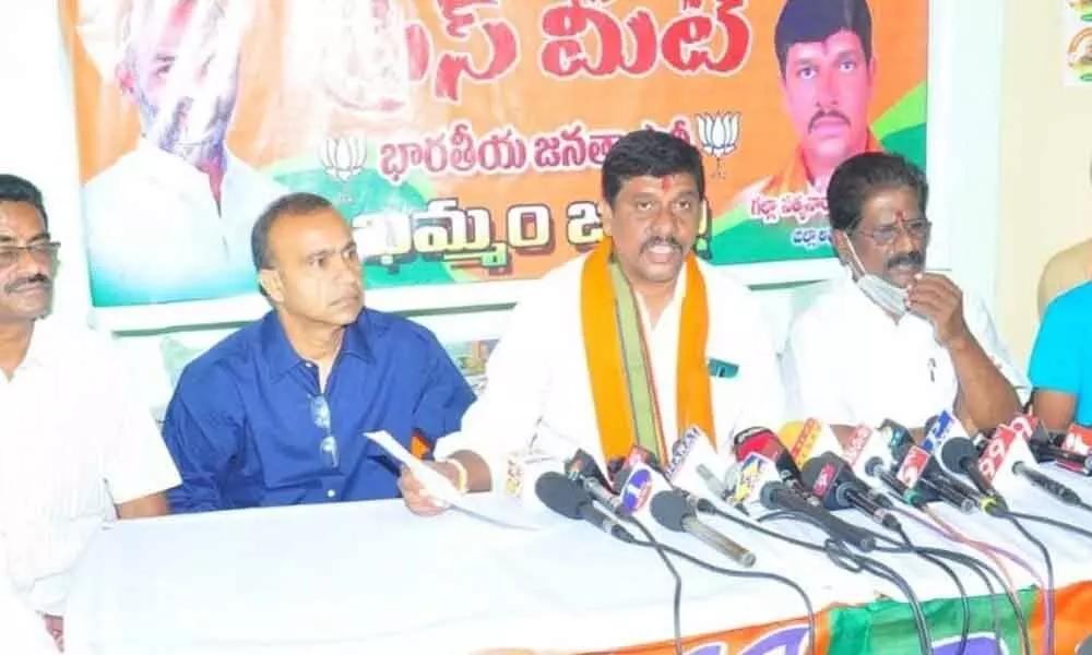 BJP district chief Galla Satyanarayana speaking to the media at party office in Khammam on Thursday