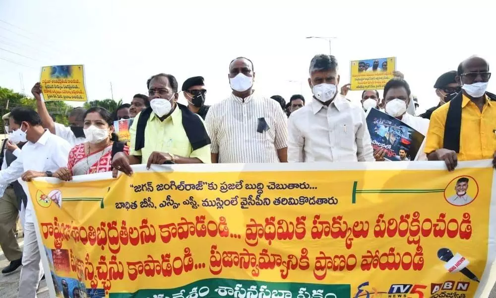 TDP legislators led by party president N Chandrabau Naidu take out a rally up to Assembly in protest against the atrocities on weaker sections, on Thursday
