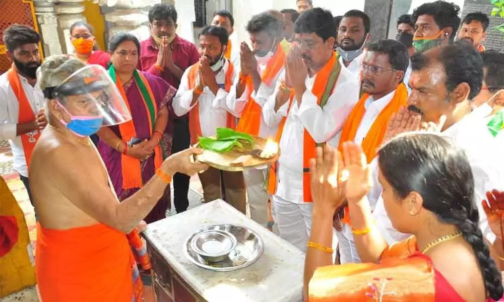 District BJP chief Galla Satyanarayana along with party activists offering prayers at Narasimha Swamy temple