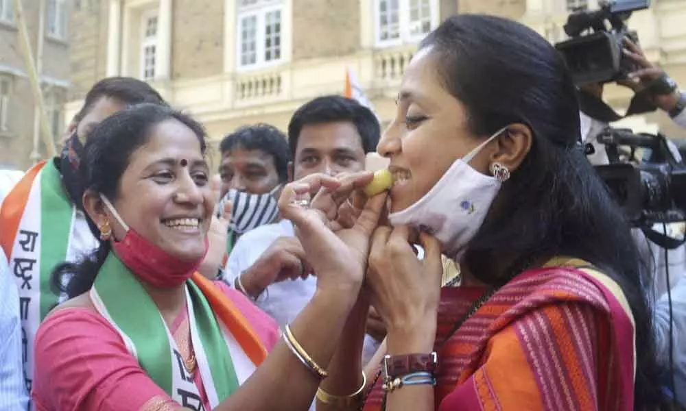 Nationalist Congress Party (NCP) leader Supriya Sule is greeted by her party workers after the Maha Vikas Aghadi (MVA) won Graduates and Teachers constituencies, in Mumbai on Friday