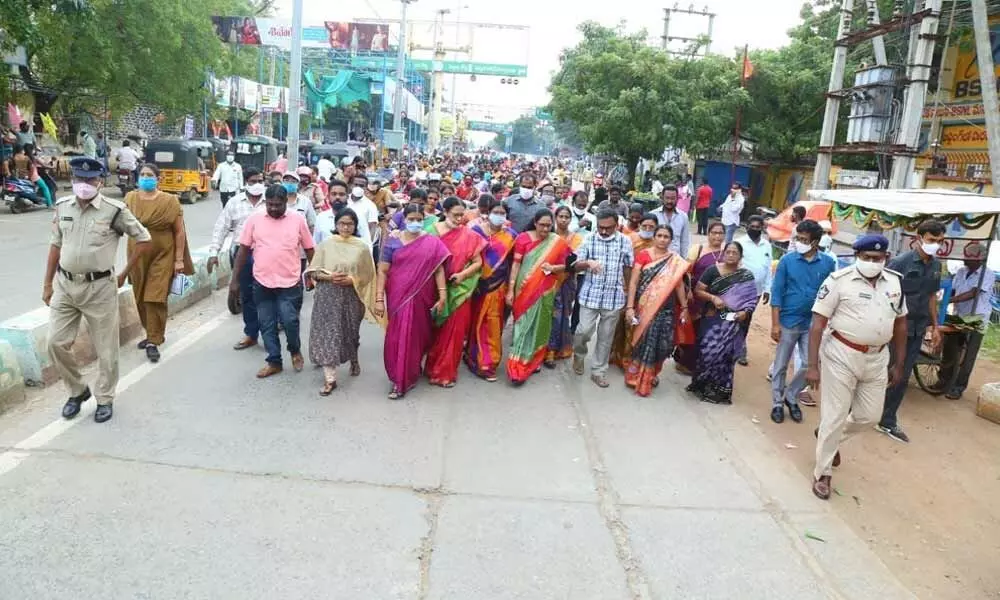 Women Commission Chairperson Vasireddy Padma and Collector Dr Pola Bhaskara participating in Mahila March 100 days rally in Ongole on Friday