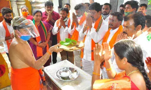 District BJP chief Galla Satyanarayana along with party activists offering prayers at Narasimha Swamy temple in Khammam on Friday
