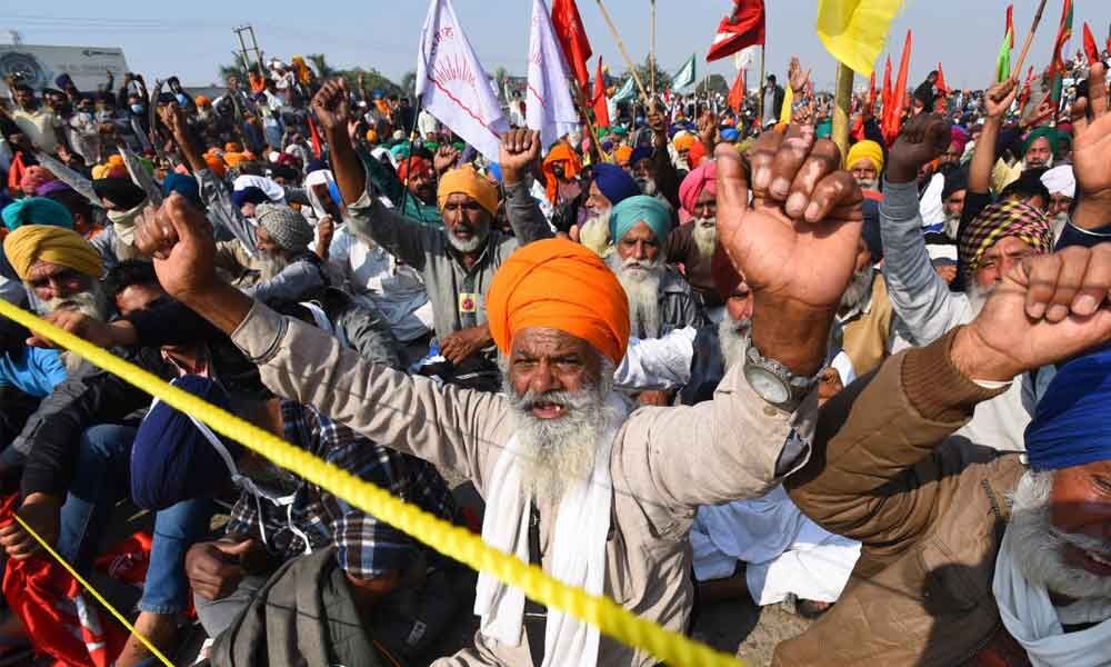 Agitating farmers, adamant Modi