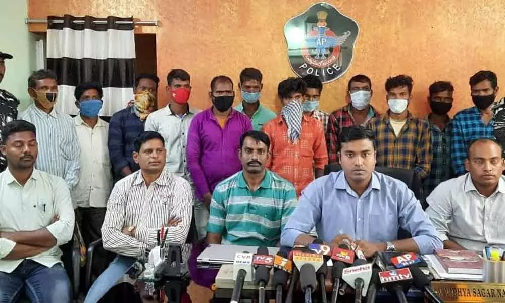 ASP Vidhya Sagar Naidu producing the surrendered militia members before the media at Chintapalli in Visakhapatnam district