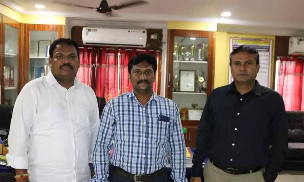 Physical Director Shaik Fiaz being congratulated by secretary and correspondent of PACE Institute of Technology and Sciences and principal Dr M Srinivasan in Ongole on Saturday
