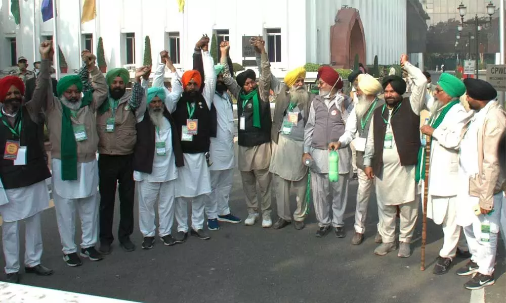 Representatives of various farmer unions arrive for a meeting with the government over the Centre