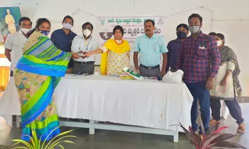 RASS K V K head Dr S Sreenivasulu felicitating farmers on the occasion of the World Soil Day at RASS-KVK in Tirupati on Saturday
