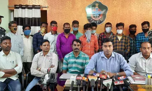 ASP Vidhya Sagar Naidu producing the surrendered militia members before the media at Chintapalli in Visakhapatnam district