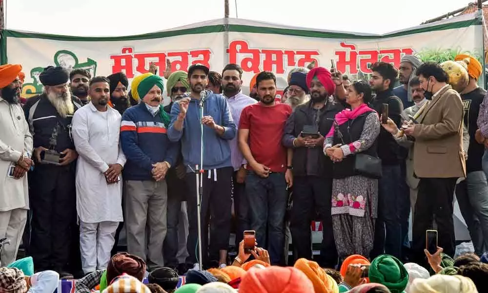 Boxer Vijender Singh with Arjuna and Dronacharya awardee sportspersons joins farmers ongoing Delhi Chalo protest march against the new farm laws, at Singhu border in New Delhi on Sunday