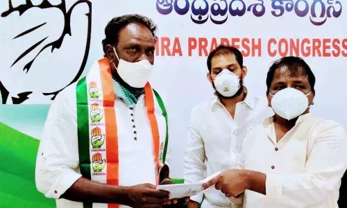 APCC State president Dr Sake Sailajanath handing over the appointment letter to Ananta Karunakar Babu in Vijayawada on Sunday