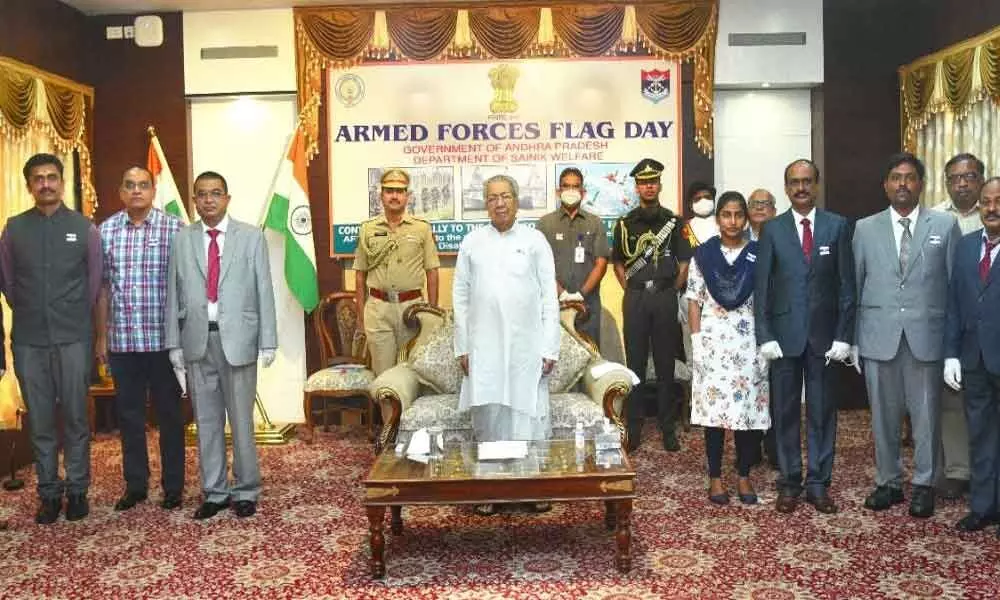 Governor Biswa Bhusan Harichandan participating in Armed Forces Flag Day celebrations
