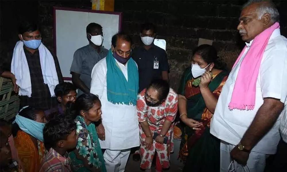 Forest and Endowment Minister Allola Indrakaran Reddy interacting with the family members of Nirmal, who was killed by a tiger, in Kondapalli village on Monday