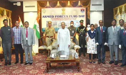 Governor Biswa Bhusan Harichandan participating in Armed Forces Flag Day celebrations