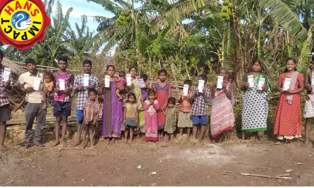 Residents of Bandulu Panuko village from G Madugula mandal with their Aadhaar and ration cards