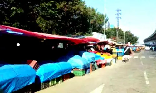 Its business as usual at Delhis grain and food markets