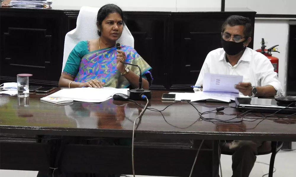 GMC Commissioner and Guntur East ERO Challa Anuradha addressing a meeting in the council hall in Guntur on Wednesday