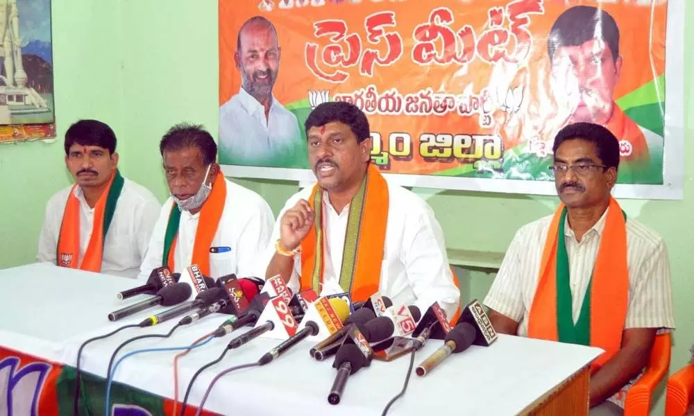 BJP district chief Galla Satyanarayana speaking to the media at party office in Khammam on Wednesday
