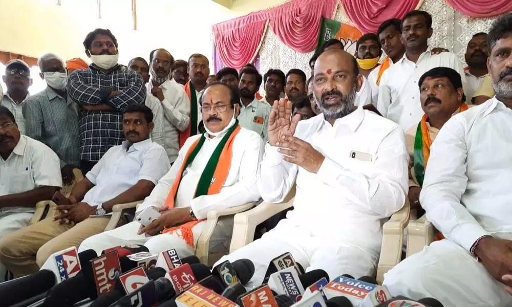 BJP State president and MP Bandi Sanjay Kumar speaking to the media at Jammikunta Krushi Bhavan in Karimnagar on Wednesday