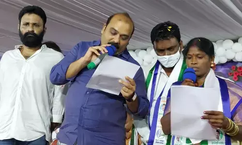 M Sunitha taking oath as the chairperson of the Gudivada market yard in Gudivada on Wednesday
