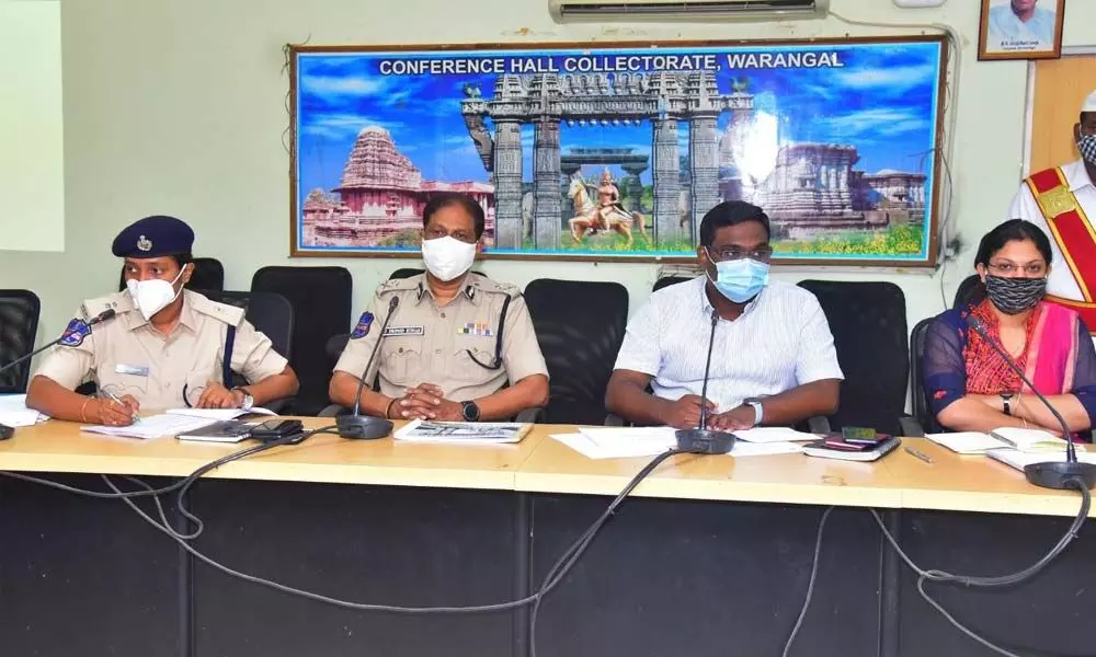 Urban District Collector Rajeev Gandhi Hanumanthu (second from right) speaking at a meeting in Warangal Urban Collectorate on Thursday