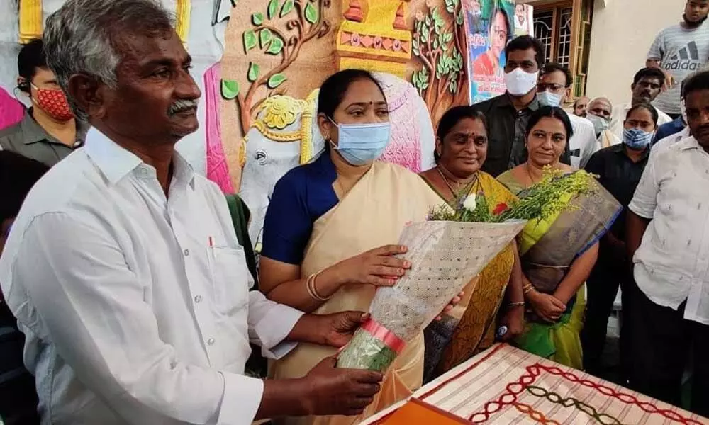 Home Minister Mekathoti Sucharita during an interaction with locals at Vinjanampadu village under Prattipadu Assembly constituency in Guntur district on Saturday