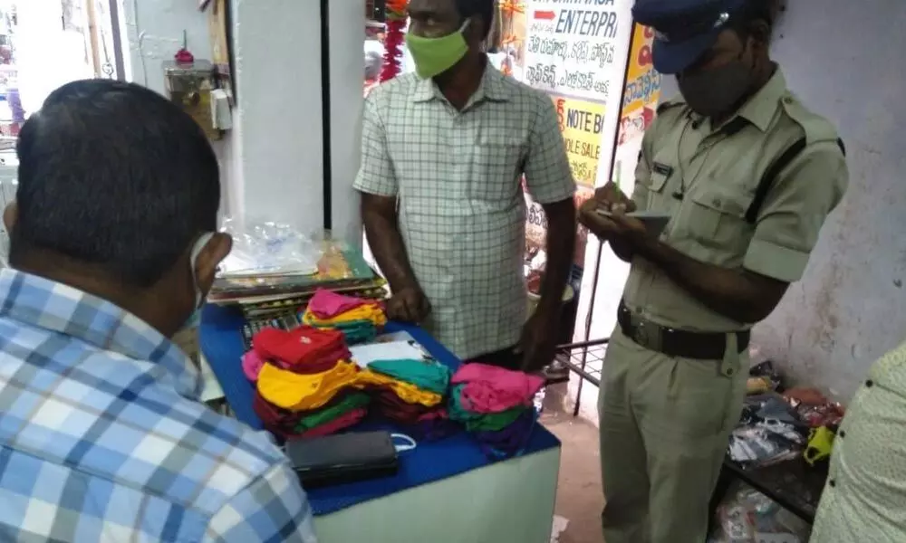 Police conducting raid on the shop selling fake masks in Vijayawada