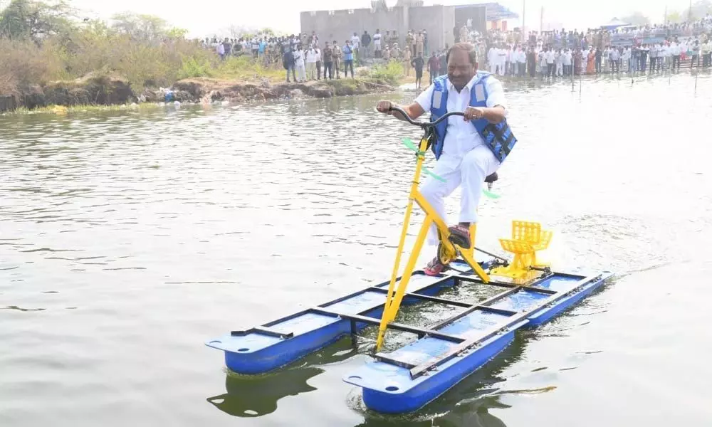 Welfare Minister K Eshwar participating in State-level boat racing competitions on River Godavari in Godavarikhani on Sunday