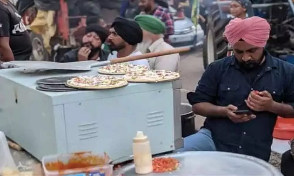 ‘Pizza langar’ at farmers’ protest: Those who give dough can also have pizzas, say organisers