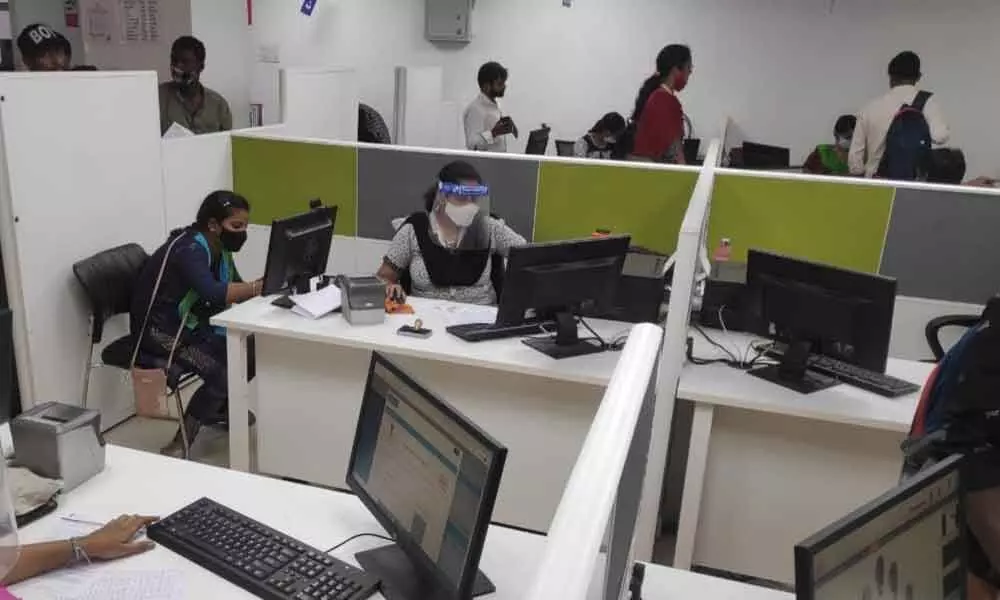 Staff at work at the UIDAI Dwarakanagar in Visakhapatnam centre.