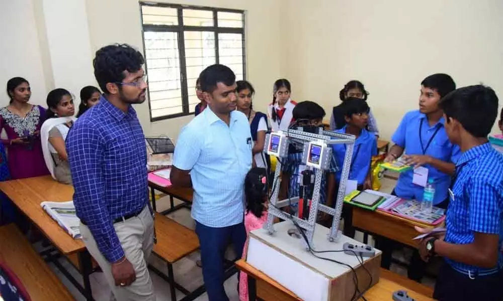 District Collector Dr N Bharat Gupta looks at a project at a Children’s Science Congress in 2019