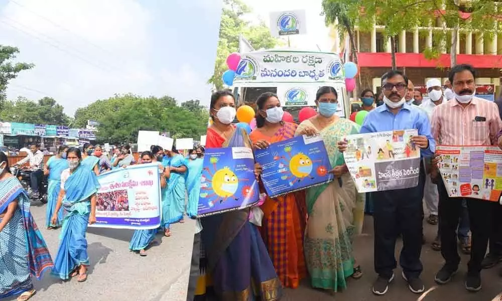 Prakasam District Collector Dr Pola Bhaskara inaugurating the Chaitanya Ratham rally and (right) launching posters to create awareness on Women Empowerment in Ongole on Monday