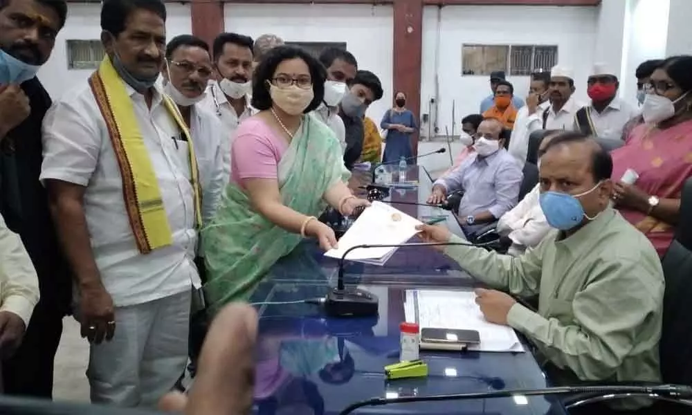 TDP leader P Aditi Gajapathi Raju giving a memorandum to Collector M Hari Jawaharlal in Vizianagaram on Monday