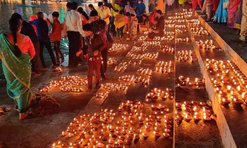 Devotees taking part in Laksha Deepotsavam at Srisailam temple on Monday