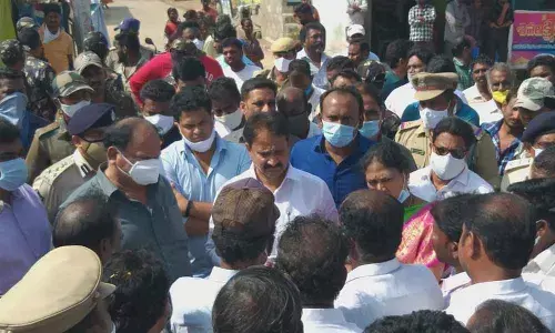 Rajyasabha MP Mopidevi Venkataramana pacifying the people during his visit to Chirala on Monday
