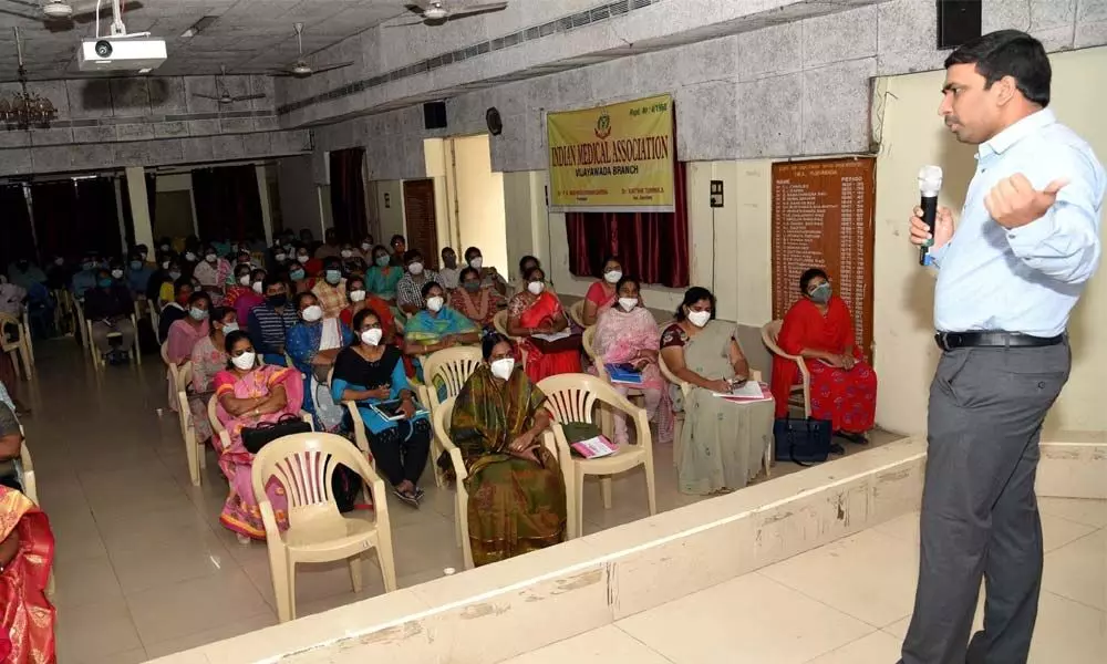 Joint Collector L Sivasankar explaining the details of Covid-19 vaccination to the medical officers at the IMA hall in Vijayawada on Tuesday