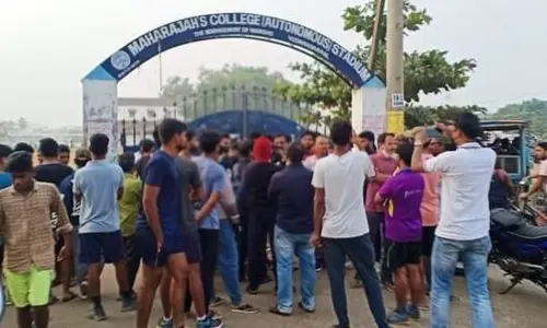 Locals staging dharna in front of the closed gate of Ayodhya Maidan in Vizianagaram on Tuesday