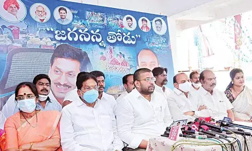 Rajanagaram MLA Jakkampudi Raja and city coordinator SS Subramanyam addressing reporters in Rajamahendravaram on Tuesday