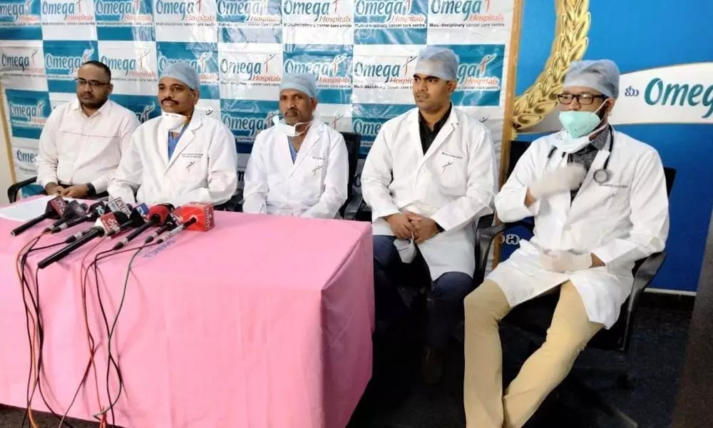 Omega Hospital chief oncologist Dr MG Naga Kishore addressing the media at hospital in Guntur on Wednesday