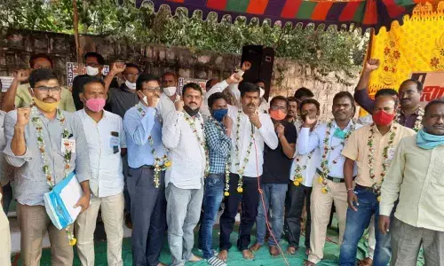 Members of various teacher unions staging a dharna in front of Karimnagar Collectorate on Thursday