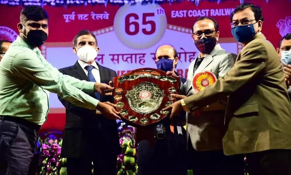 Divisional Railway Manager, Waltair, Chetan Kumar Shrivastava receiving shield as a part of the 65th Railway Week celebrations by ECoR at Bhubaneswar on Friday