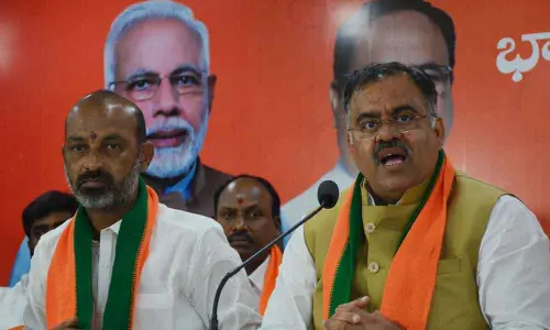 BJP National Secretary and Telangana State Incharge Tarun Chugh along with TS BJP president Bandi Sanjay addressing the media in Hyderabad on Friday