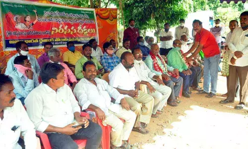 AIKSCC leaders staging a protest at Ekasila Park in Warangal on Saturday