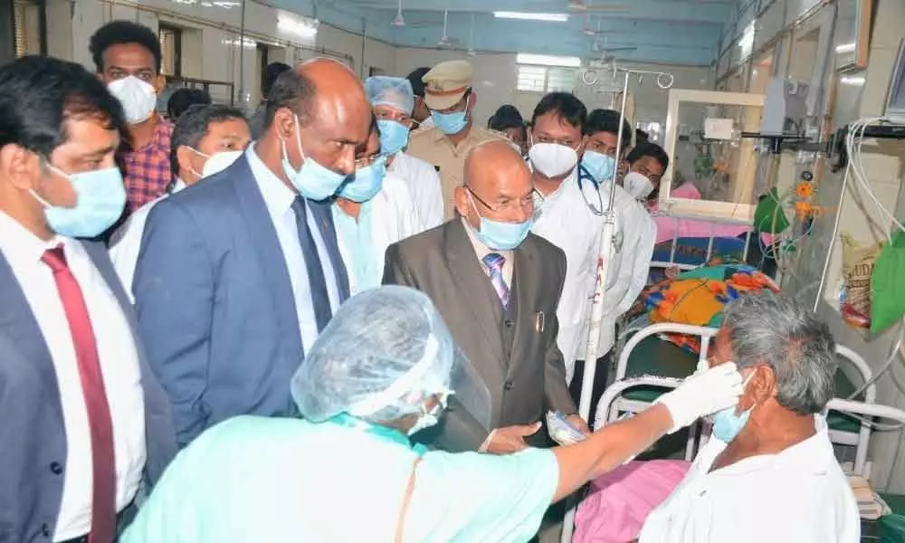 SHRC chairman Justice G Chandraiah along with other members – Nadipally Ananda Rao and Md Irfan Moinuddin - interacting with patients in the MGM Hospital in Warangal on Sunday