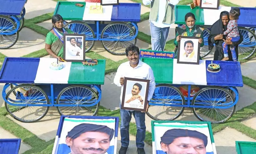 MLA B Madhusudhan Reddy distributing pushcarts to vendors in Srikalahasti on Sunday