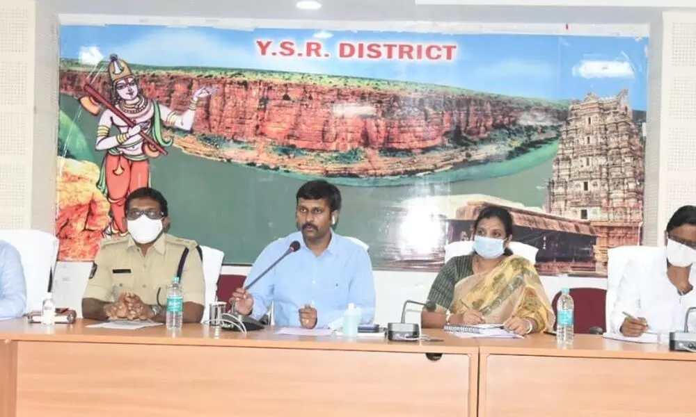 Collector Ch Harikiran holding a meeting with officials on the Chief Minister’s tour in Kadapa on Sunday