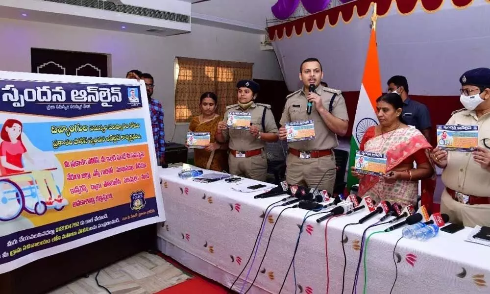 SP Siddharth Kaushal advising differently-abled persons to utilise Spandana Online feature, at the press meet on death of Bhuvaneswari in Ongole on Monday