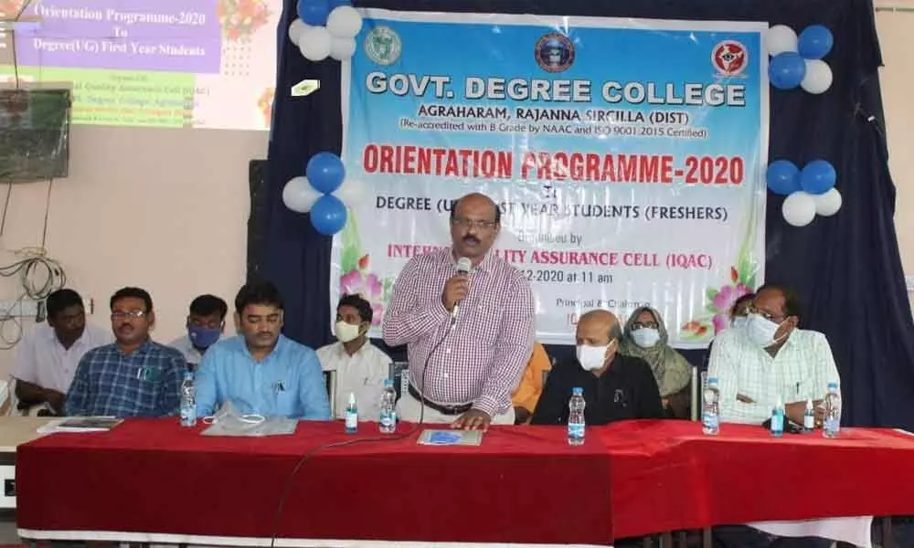 College Principal Dr T Srinivas speaking at an orientation programme in the premises of Agraharam Degree College in Sircilla on Monday